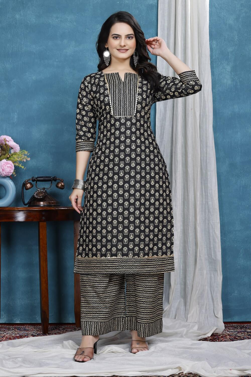 Women’s calf length black kurta with floral pattern