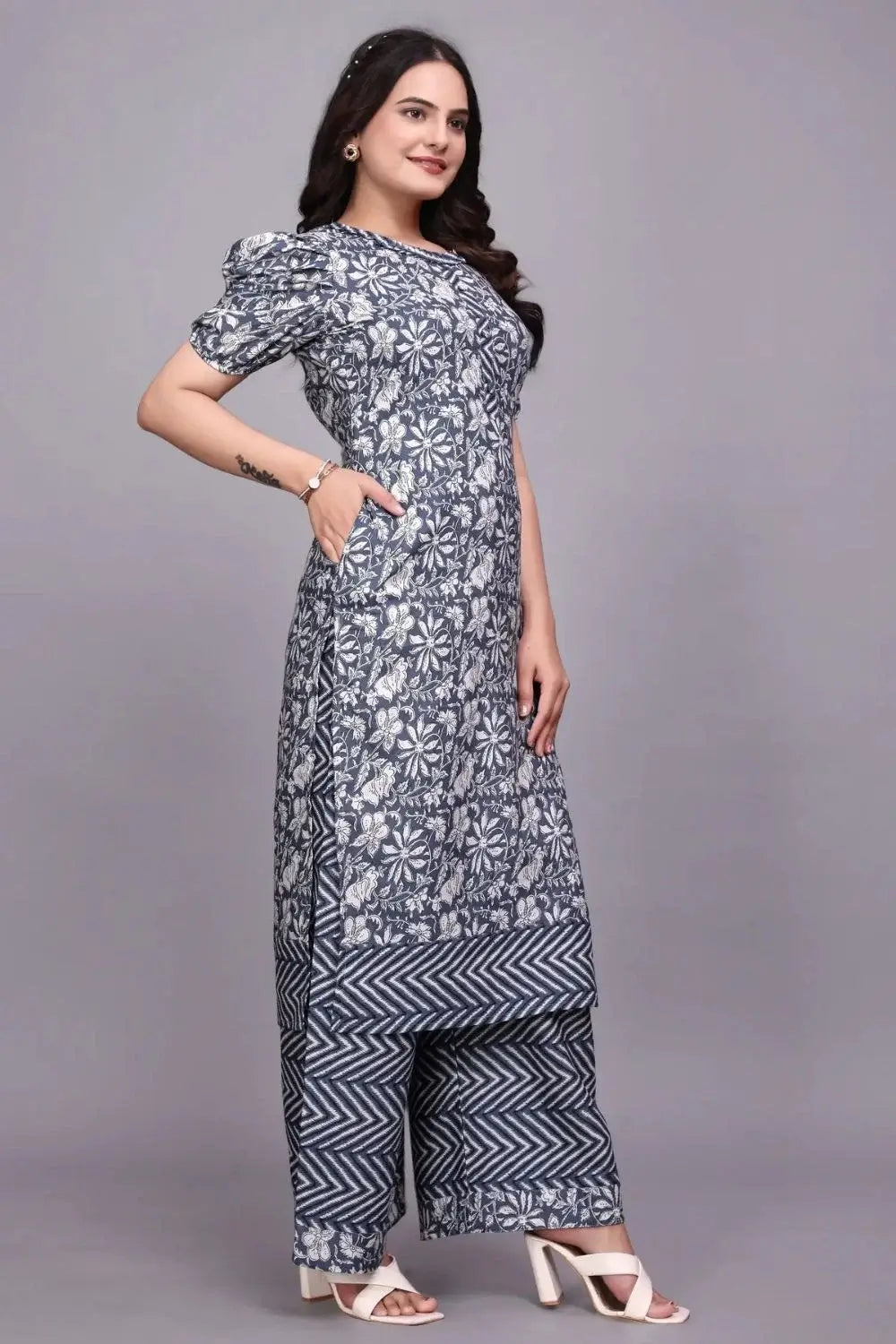 Side view of a black and white floral kurti with a side pocket, paired with chevron-print palazzo trousers.